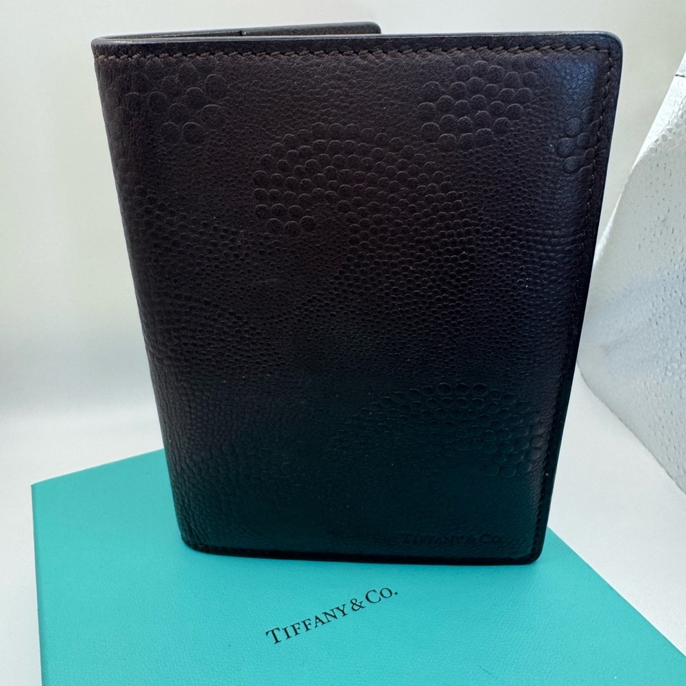 Tiffany & Co. Elegant Dark Leather passport wallet.
